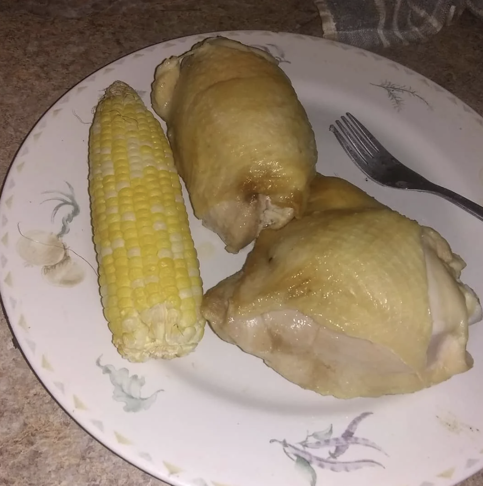 Chicken and corn on a cob on a plate