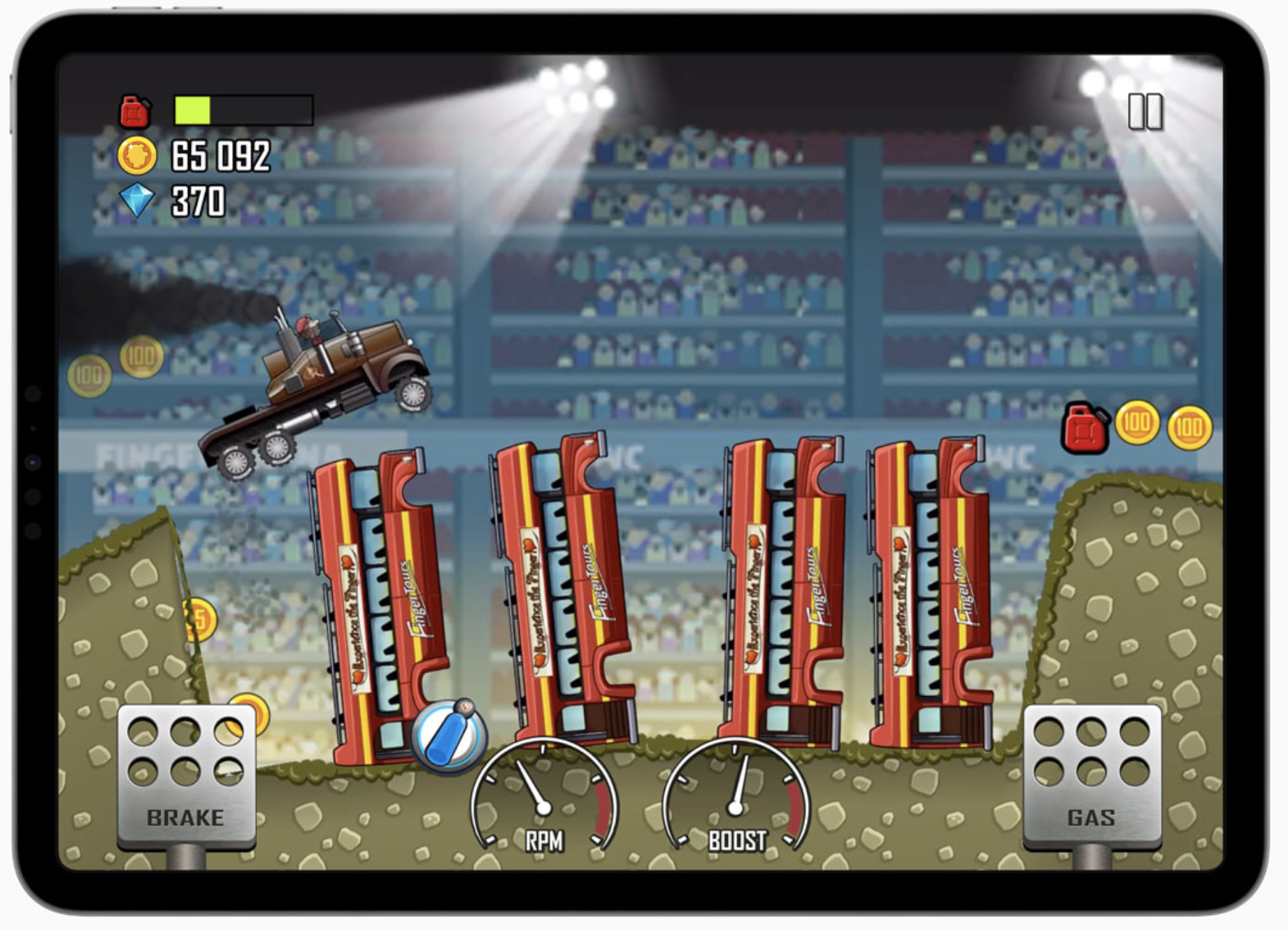 A truck jumps over wrecked vehicles in &quot;Hill Climb Racing+&quot;