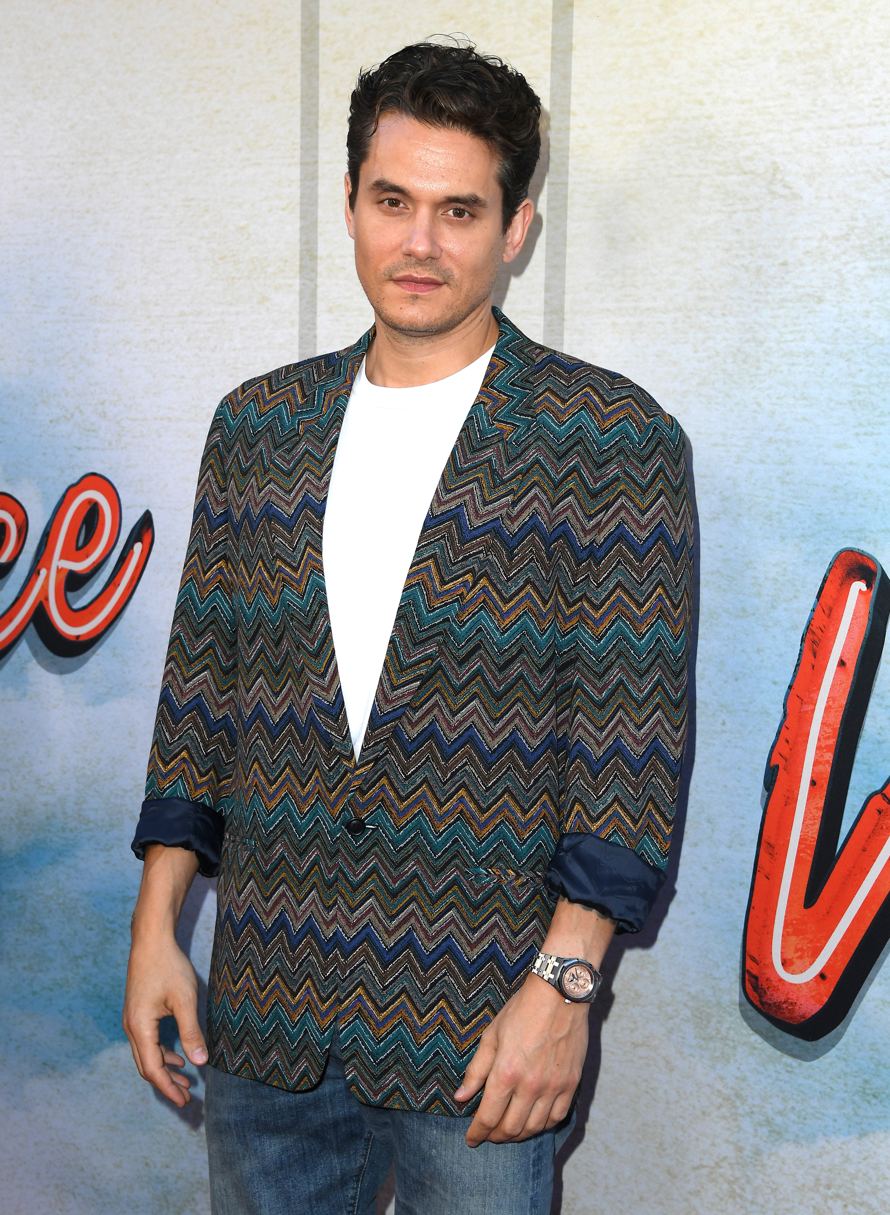 Mayer in jeans and a sweater