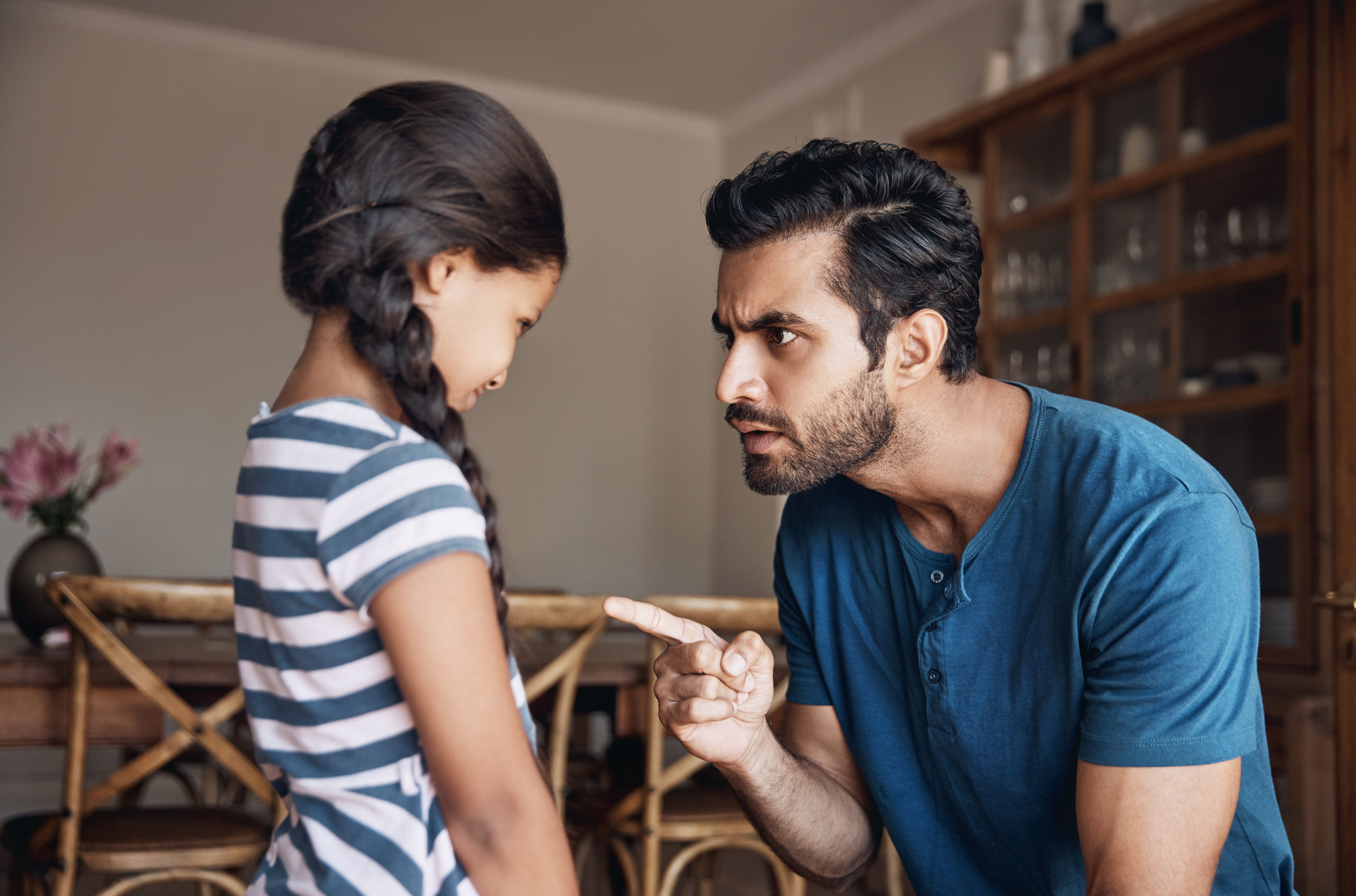 Angry dad yelling at daughter