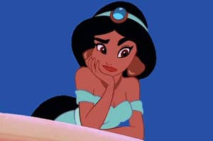 jasmine from aladdin rests her head on her hand, furrows brows