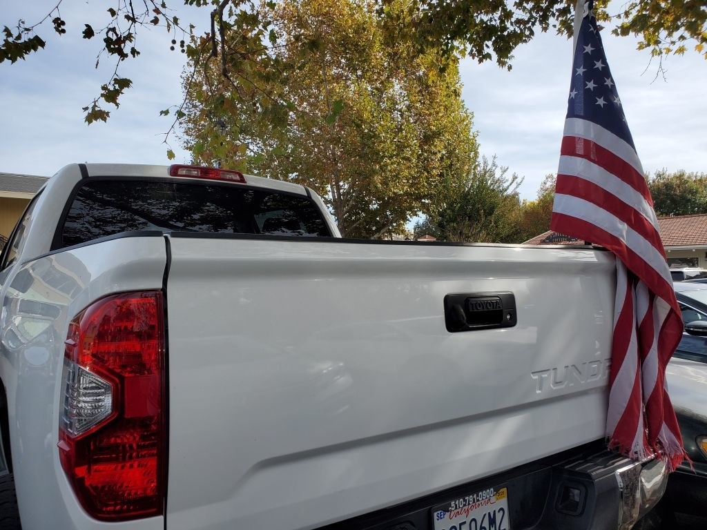A truck with an American flag