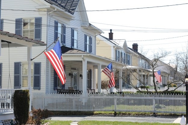 Street full of homes with American flags