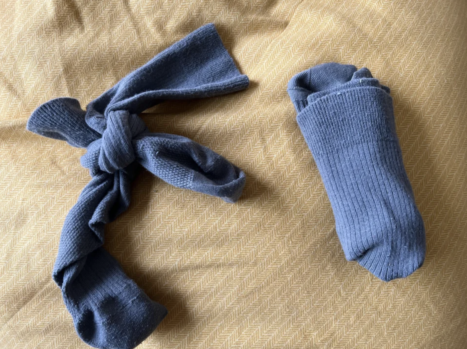 The pair of socks is tied in a bow