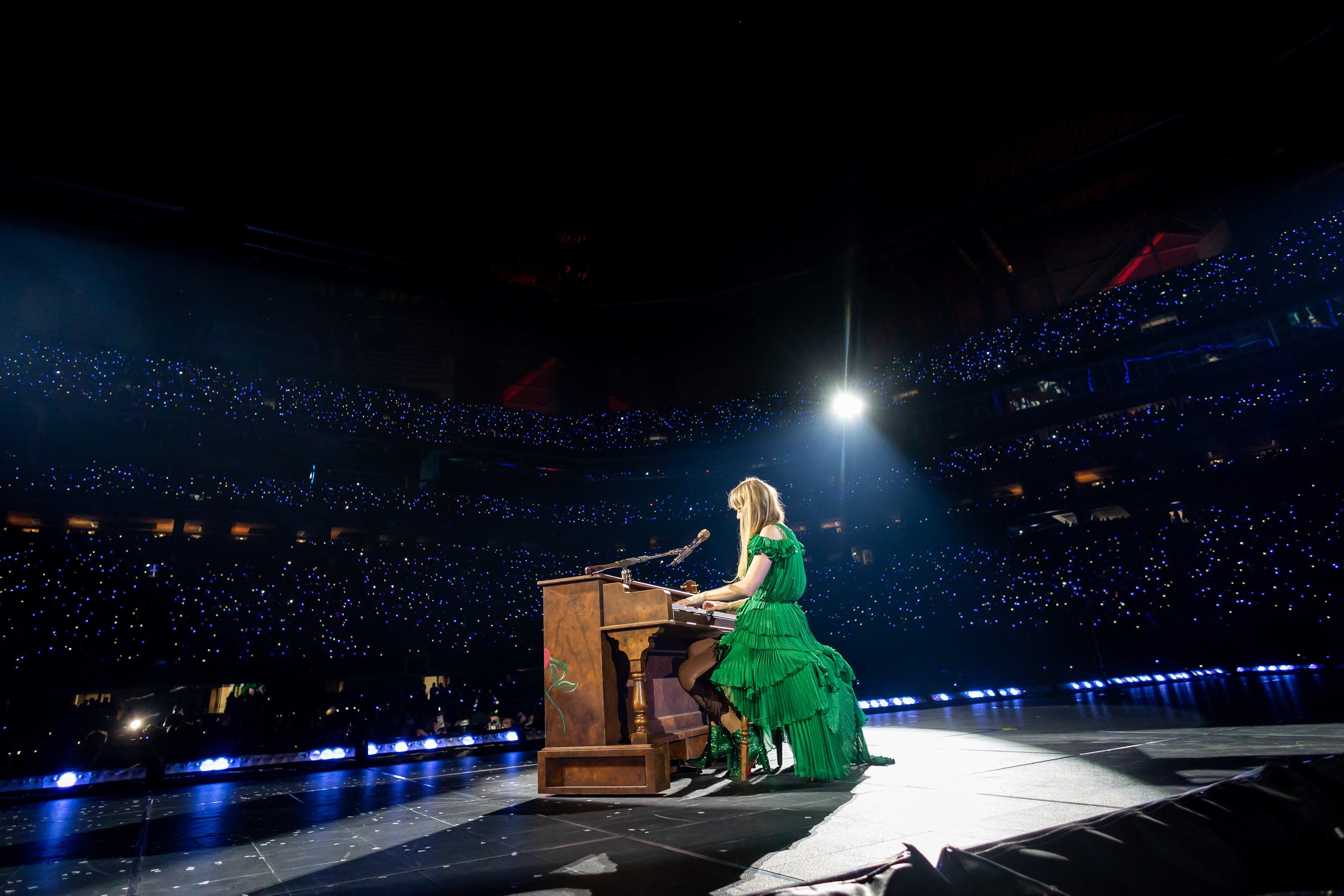 Taylor Swift wearing a green dress