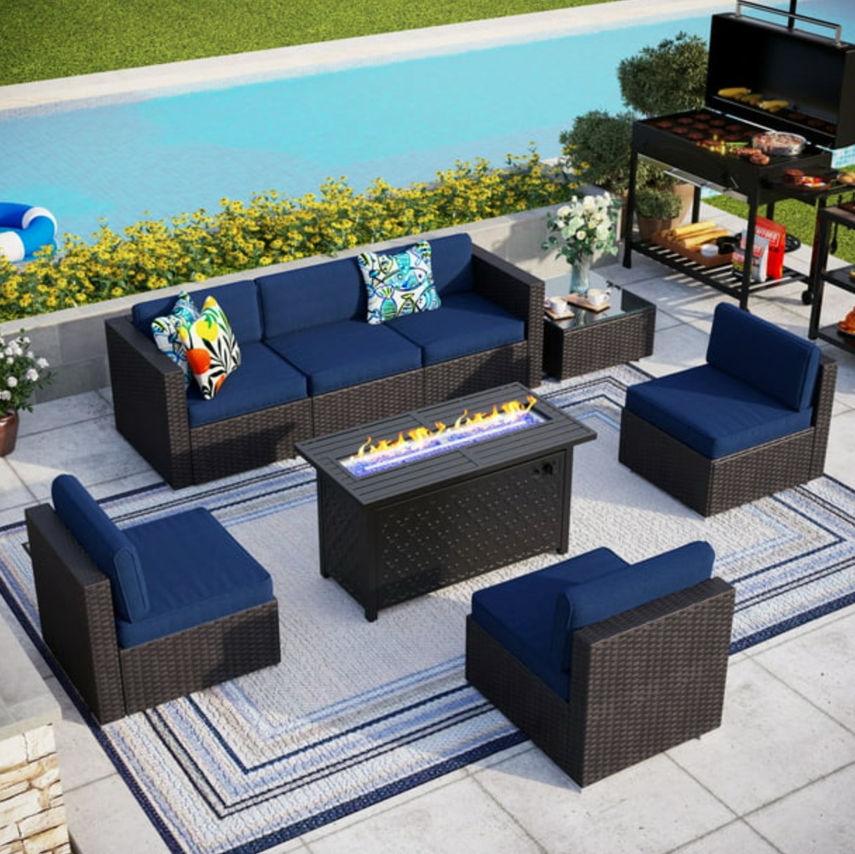 the dark wicker and navy cushioned set with a fire pit table in the center