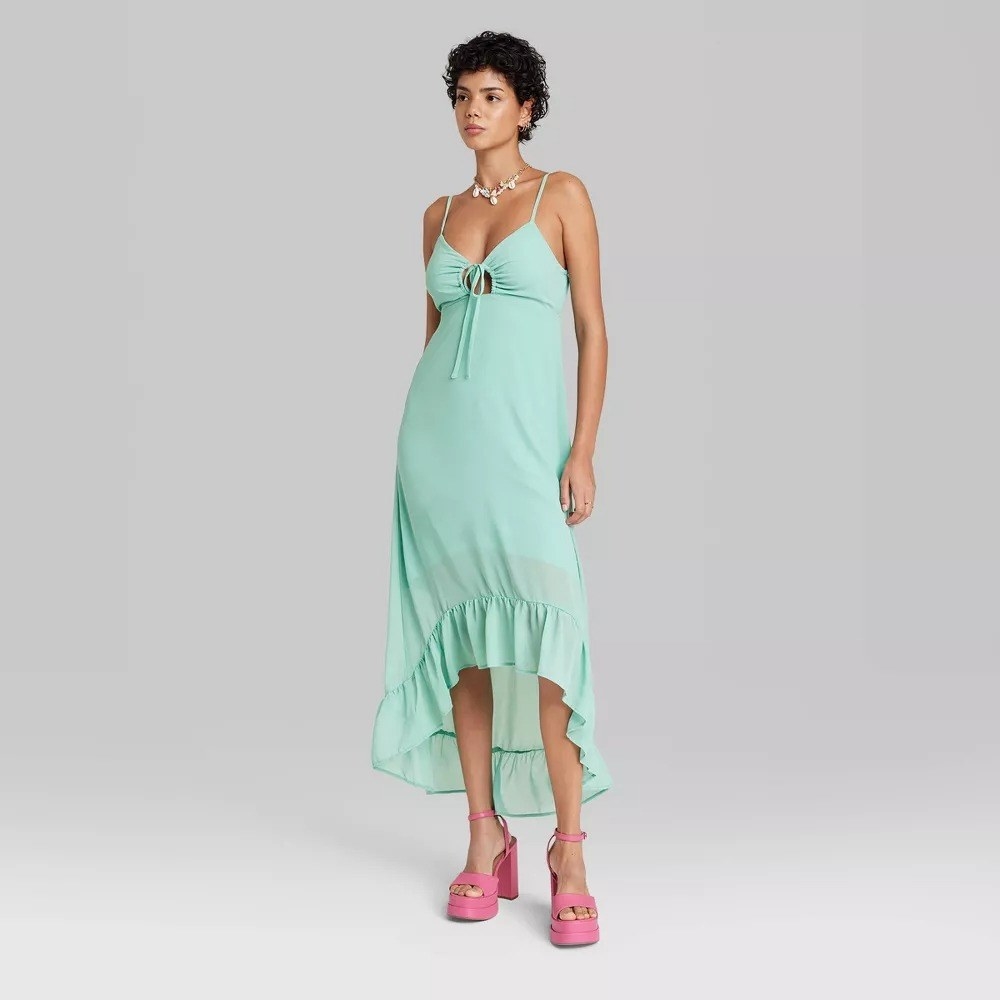 A model in the mint high-low dress