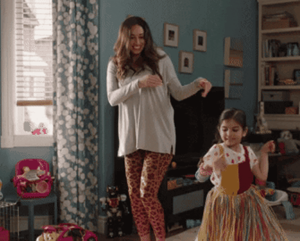 gif of parent and child dancing in living room