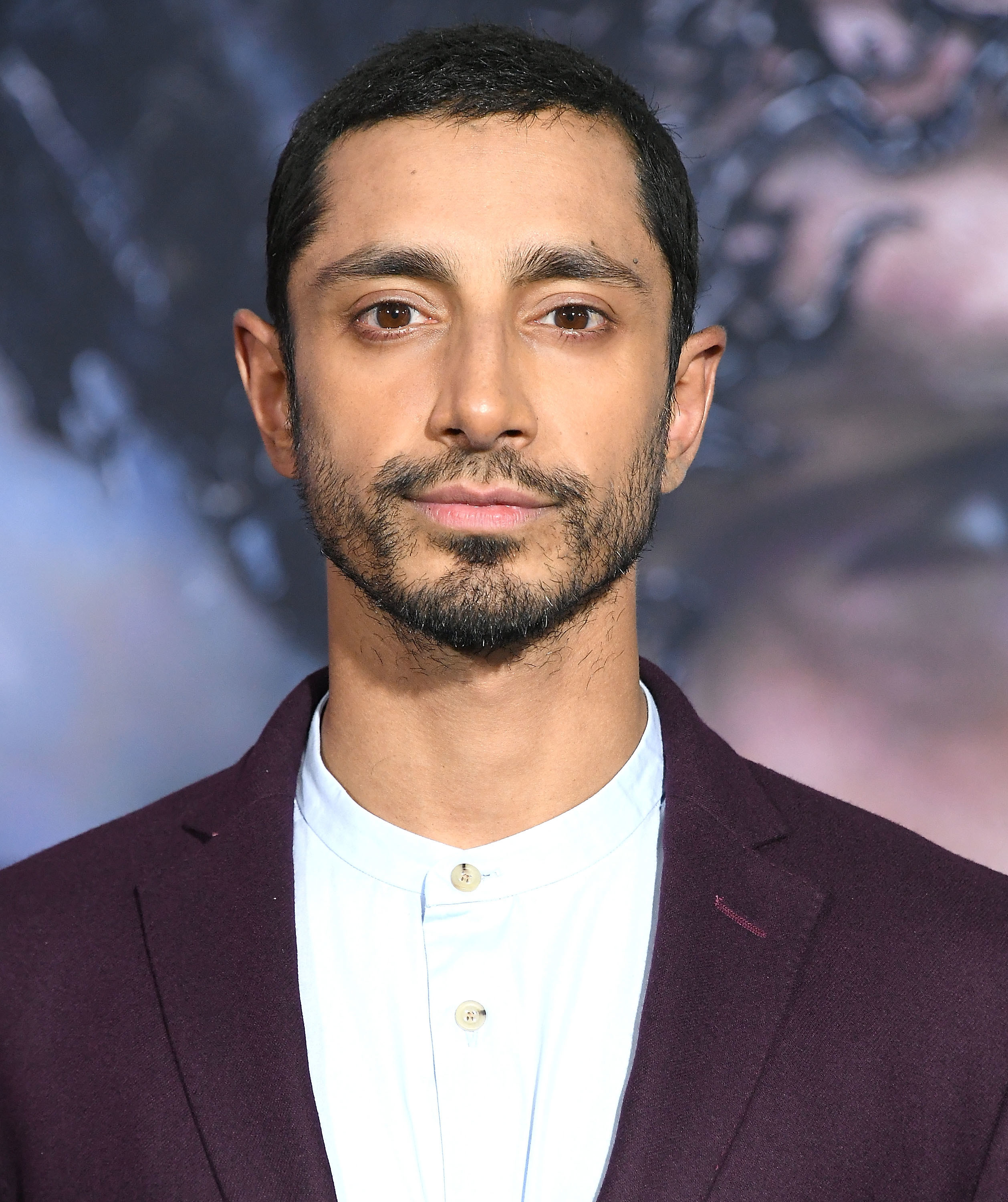 Riz Ahmed in a stylish suit