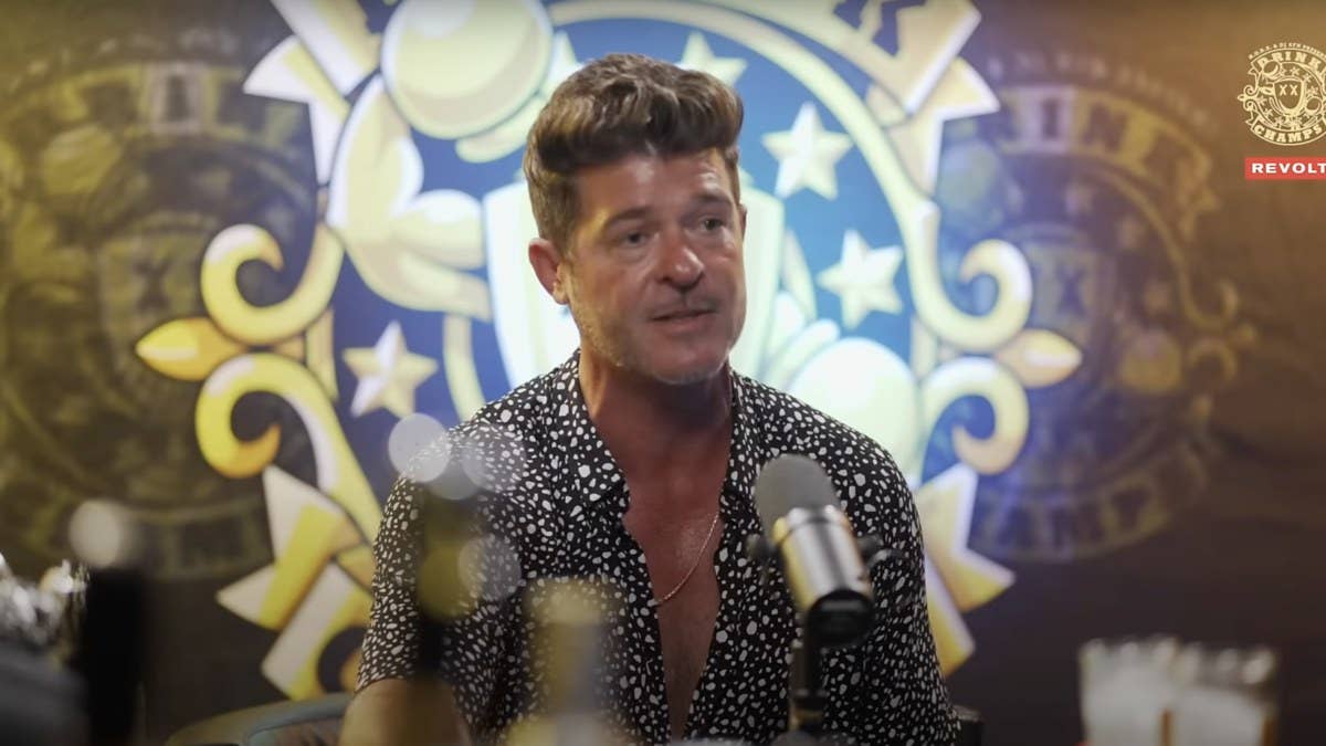 In a new episode of 'Drink Champs,' Robin Thicke discussed whether or not he tried to get his ex-wife back with his 'Paula' album.