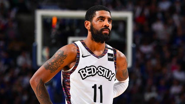 Following the termination of its endorsement deal, Brooklyn Nets star Kyrie Irving covers the logos on his Nike Kyrie 3 sneakers. Click here to learn more.