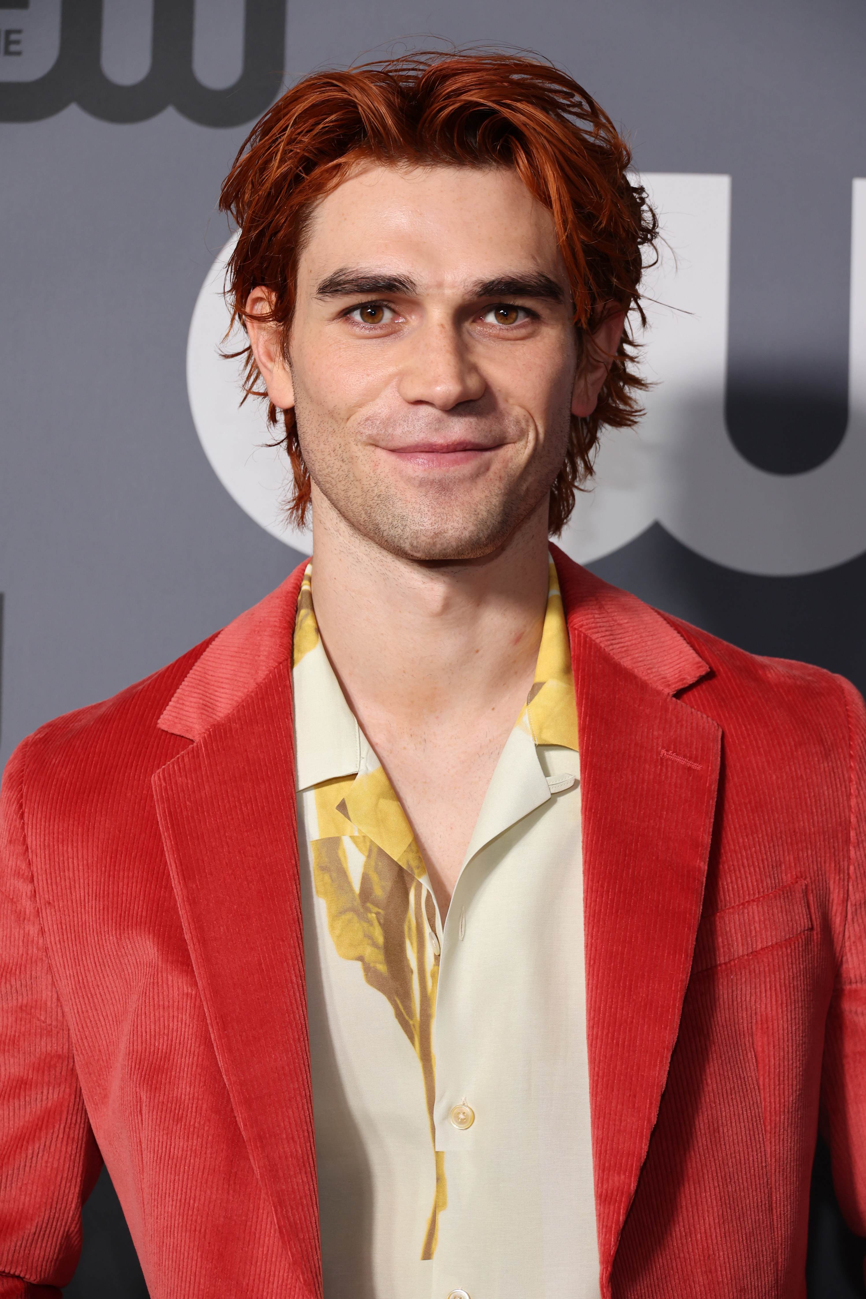 KJ in a red suit