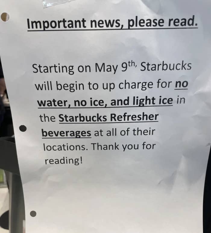 a sign at Starbucks describing an upcharge