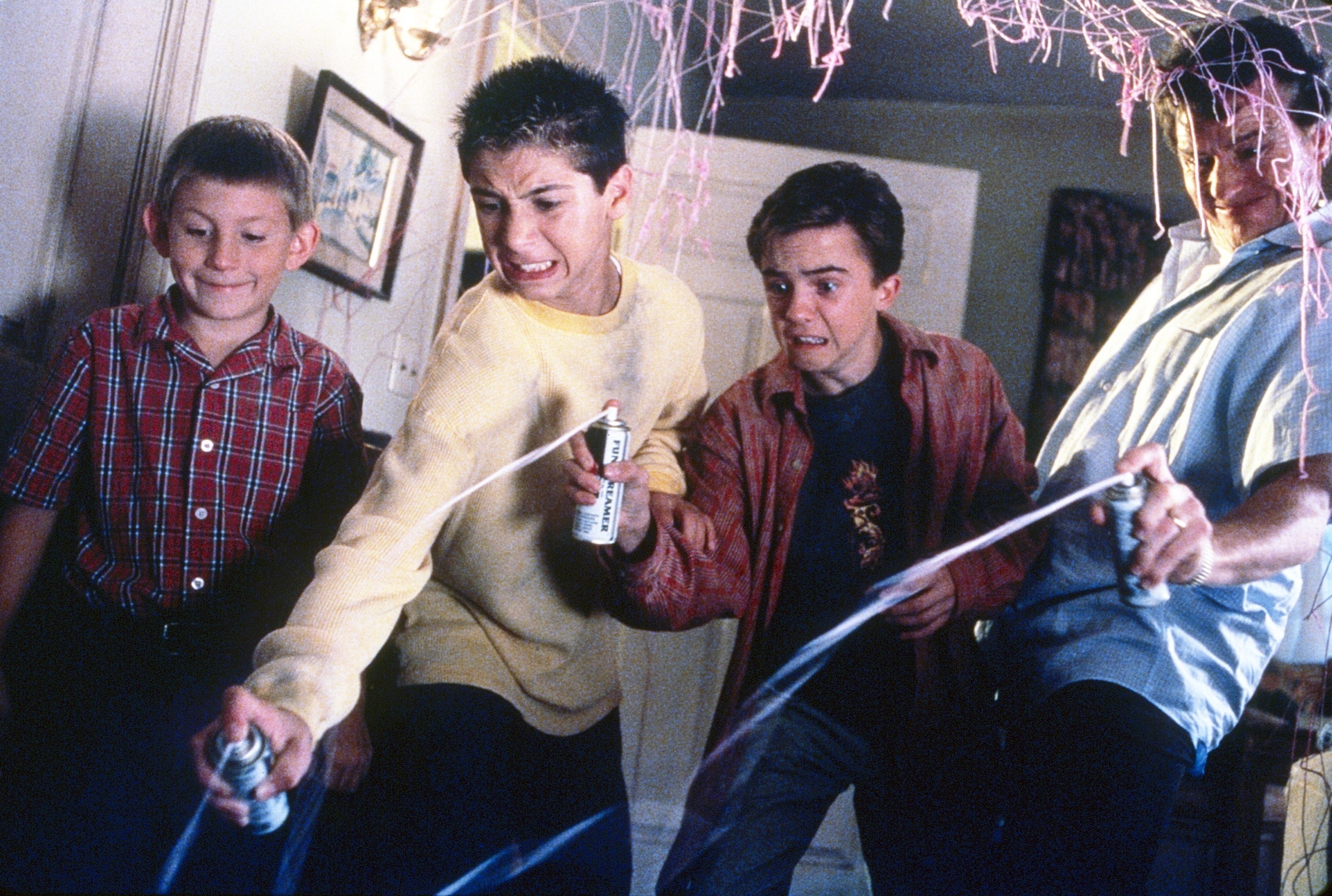 Malcolm and his friends spray silly string on the floor
