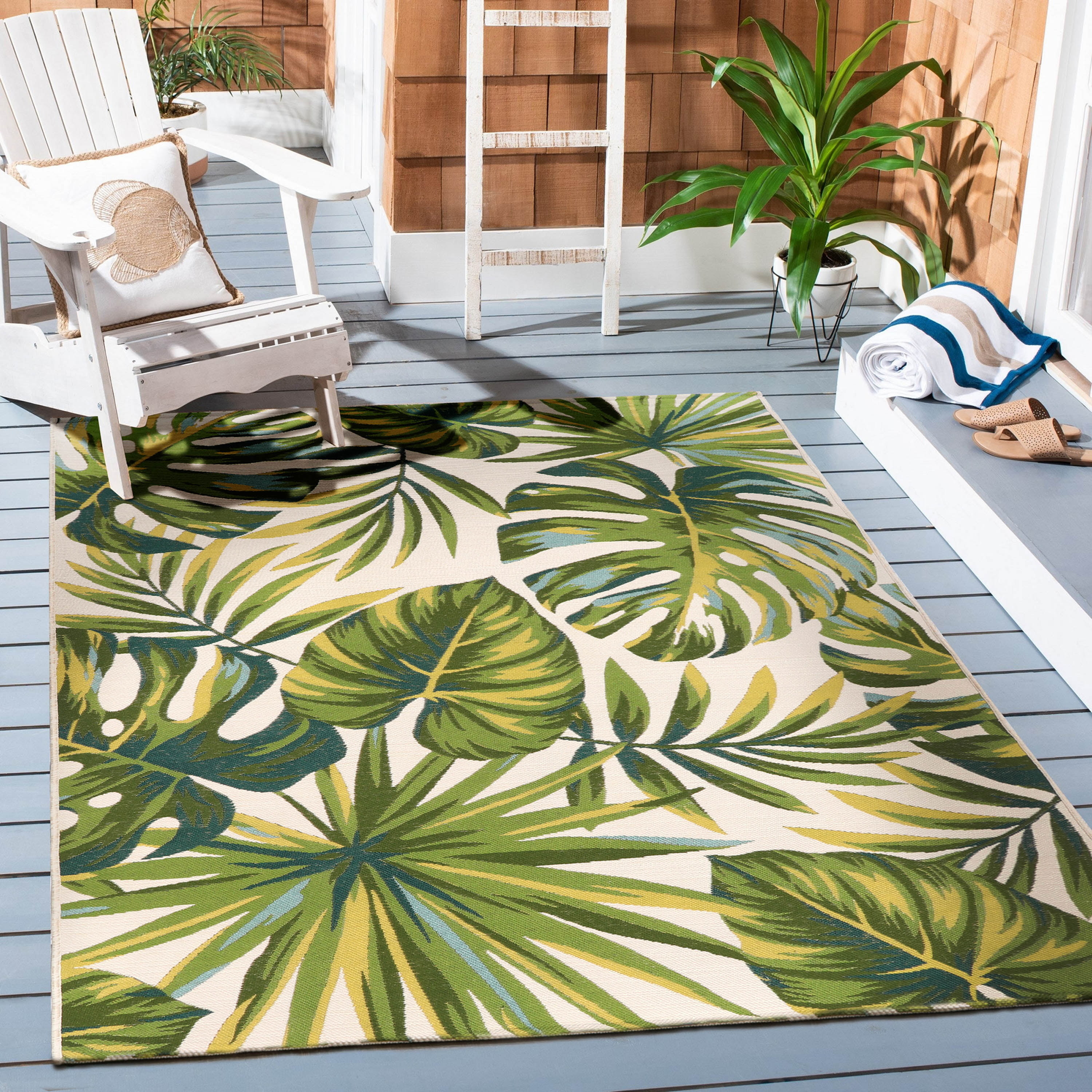 the outdoor rug featuring palm tree leaves