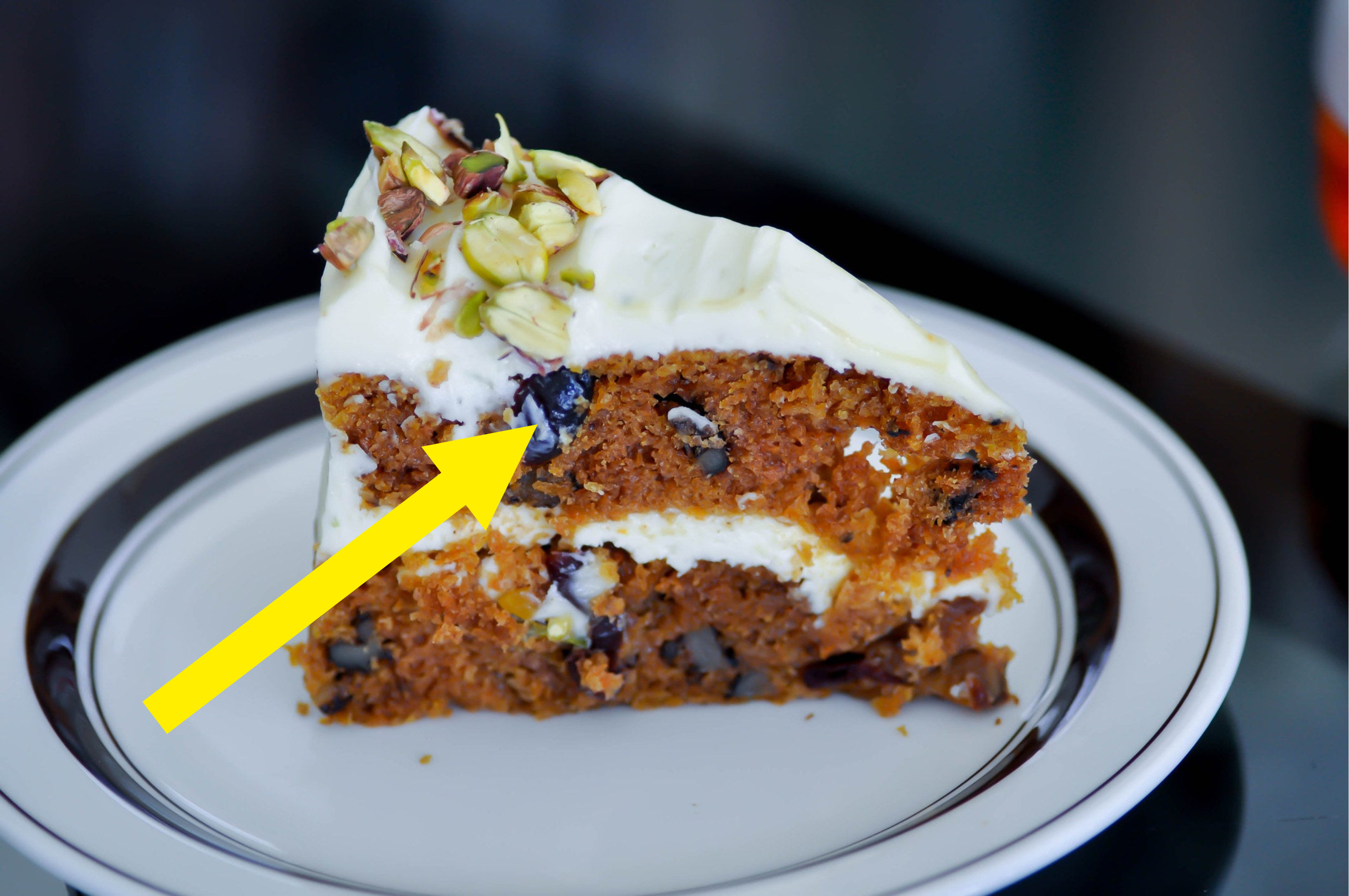 Carrot and raisin cake with pistachio topping