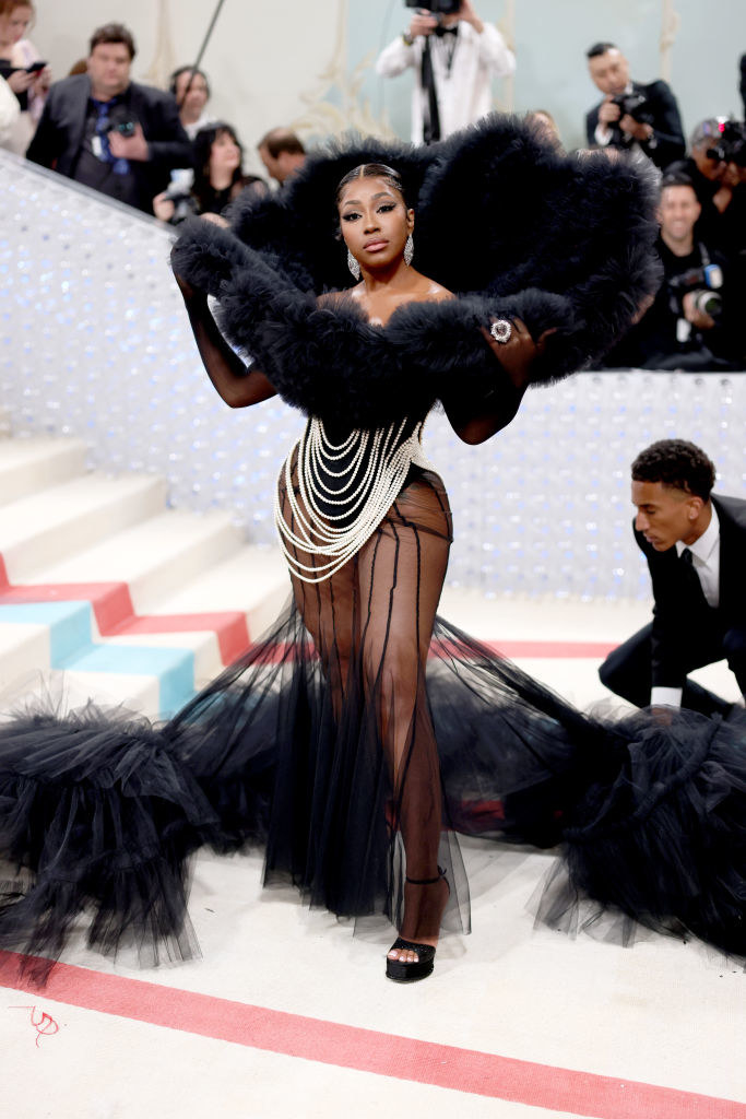 Yung Miami attends The 2023 Met Gala in a sheer gown