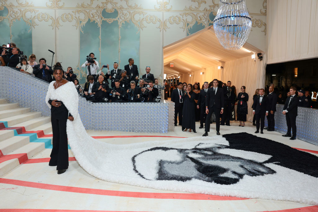 Jeremy Pope attends The 2023 Met Gala in a coat with Karl Lagerfeld&#x27;s face on it