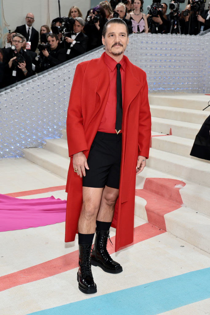 Pedro Pascal attends The 2023 Met Gala in red shorts and a red suit coat