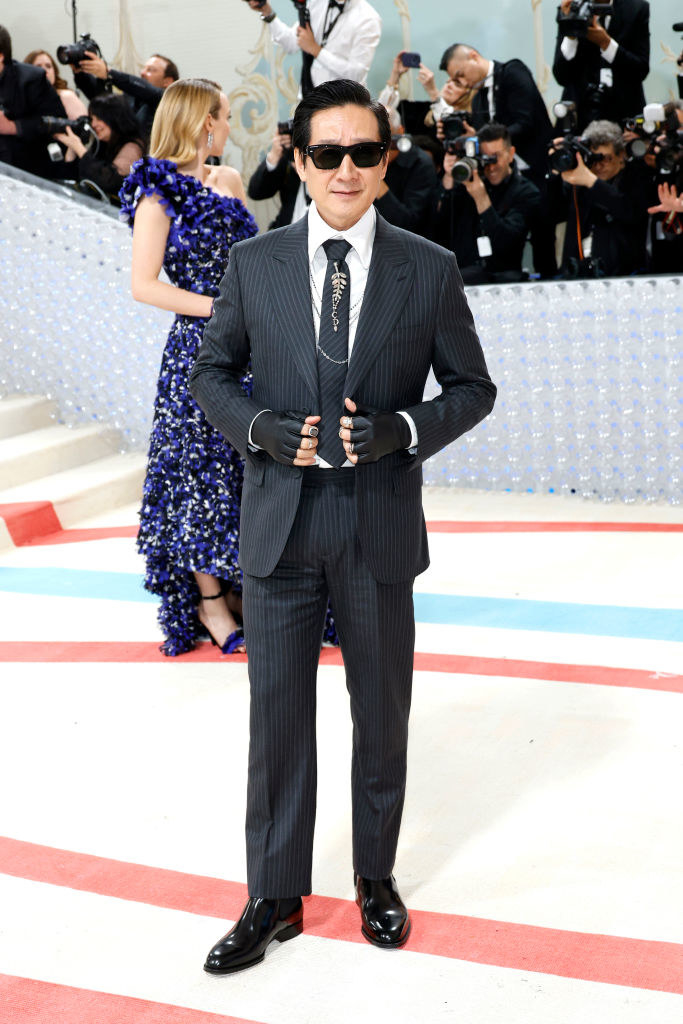 Ke Huy Quan attends The 2023 Met Gala in a striped suit
