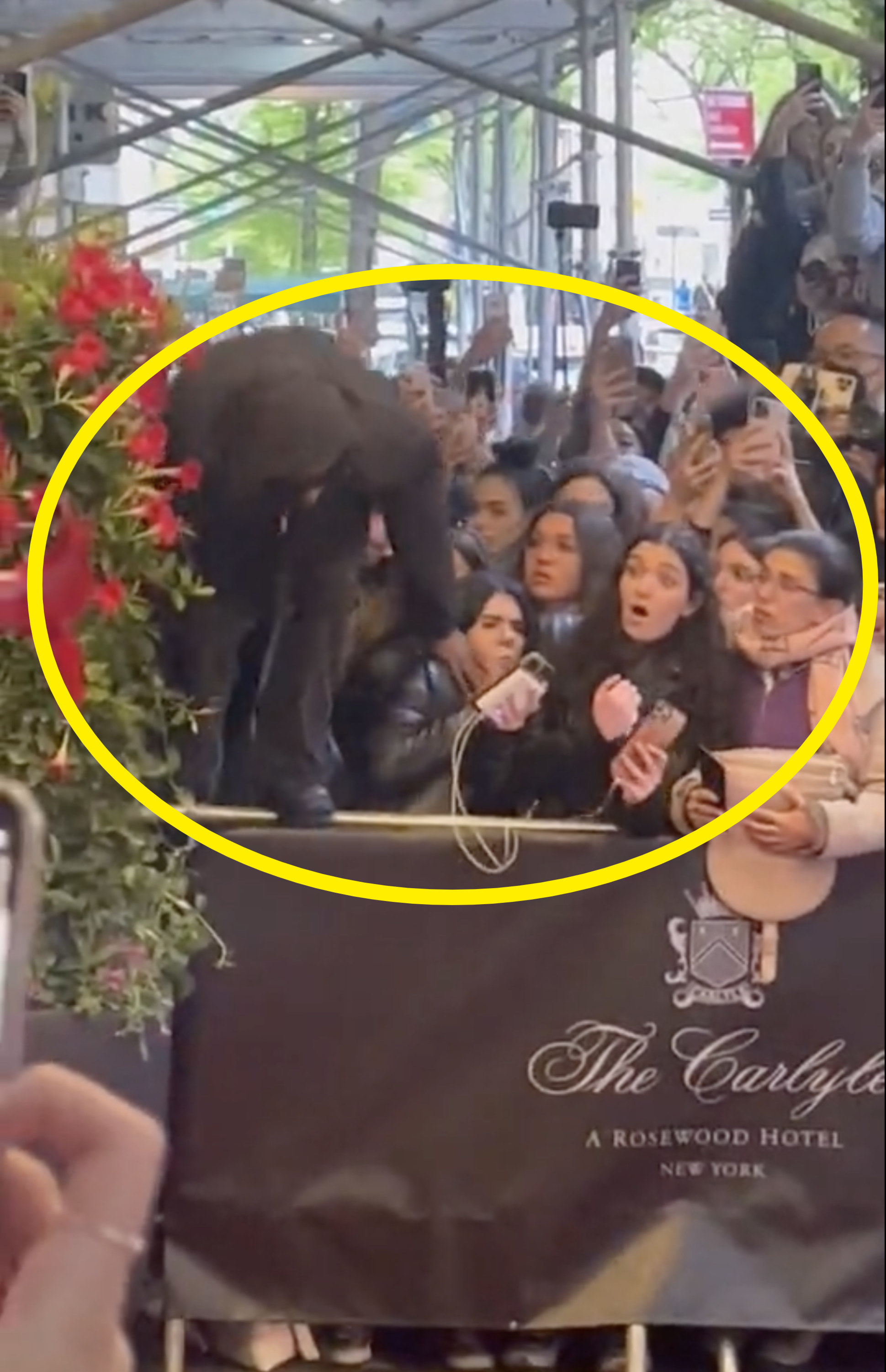 A$AP Rocky hopping a barrier