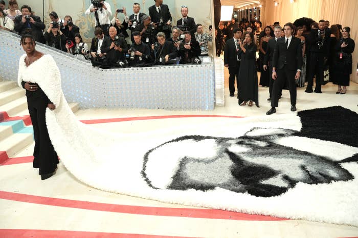 Jeremy Pope in a long cape with an illustration of Karl Lagerfeld&#x27;s face