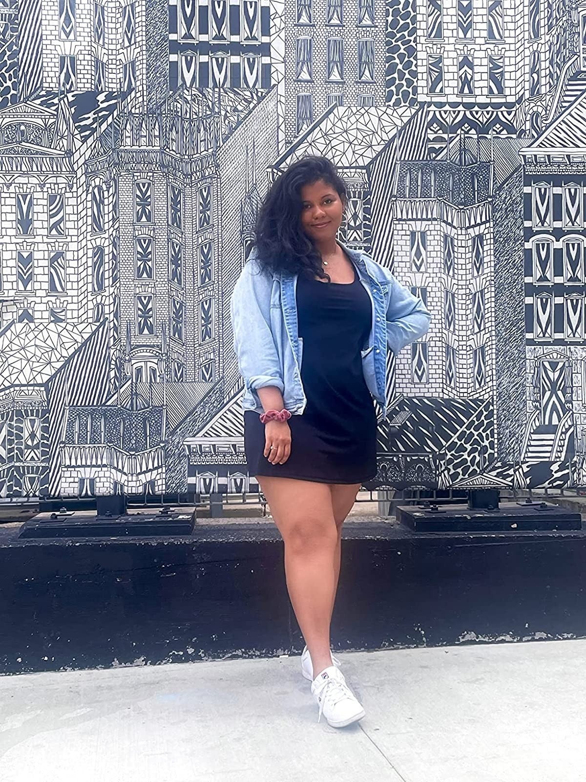 reviewer wearing achromatic  workout formal  with denim overgarment   implicit    it