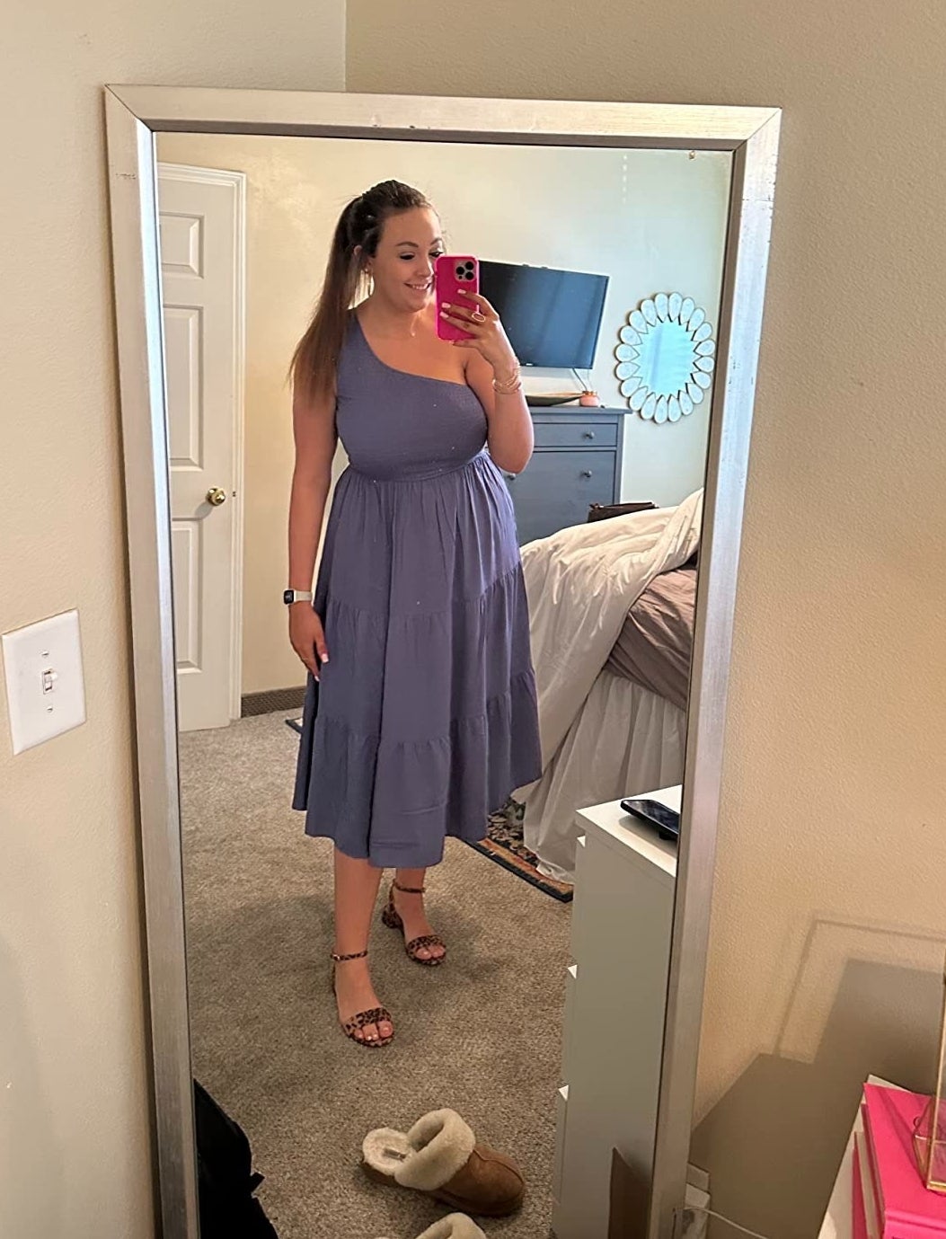 reviewer wearing purple one-shoulder maxi dress with leopard-print heels
