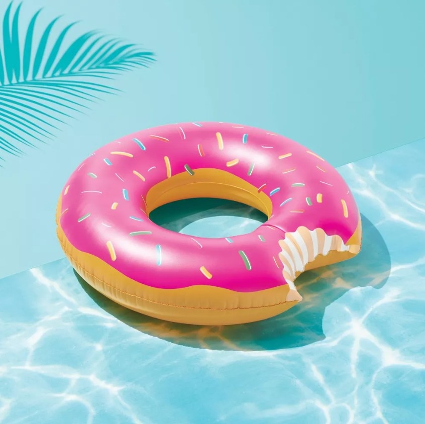 The donut pool float on a blue pool-effect background