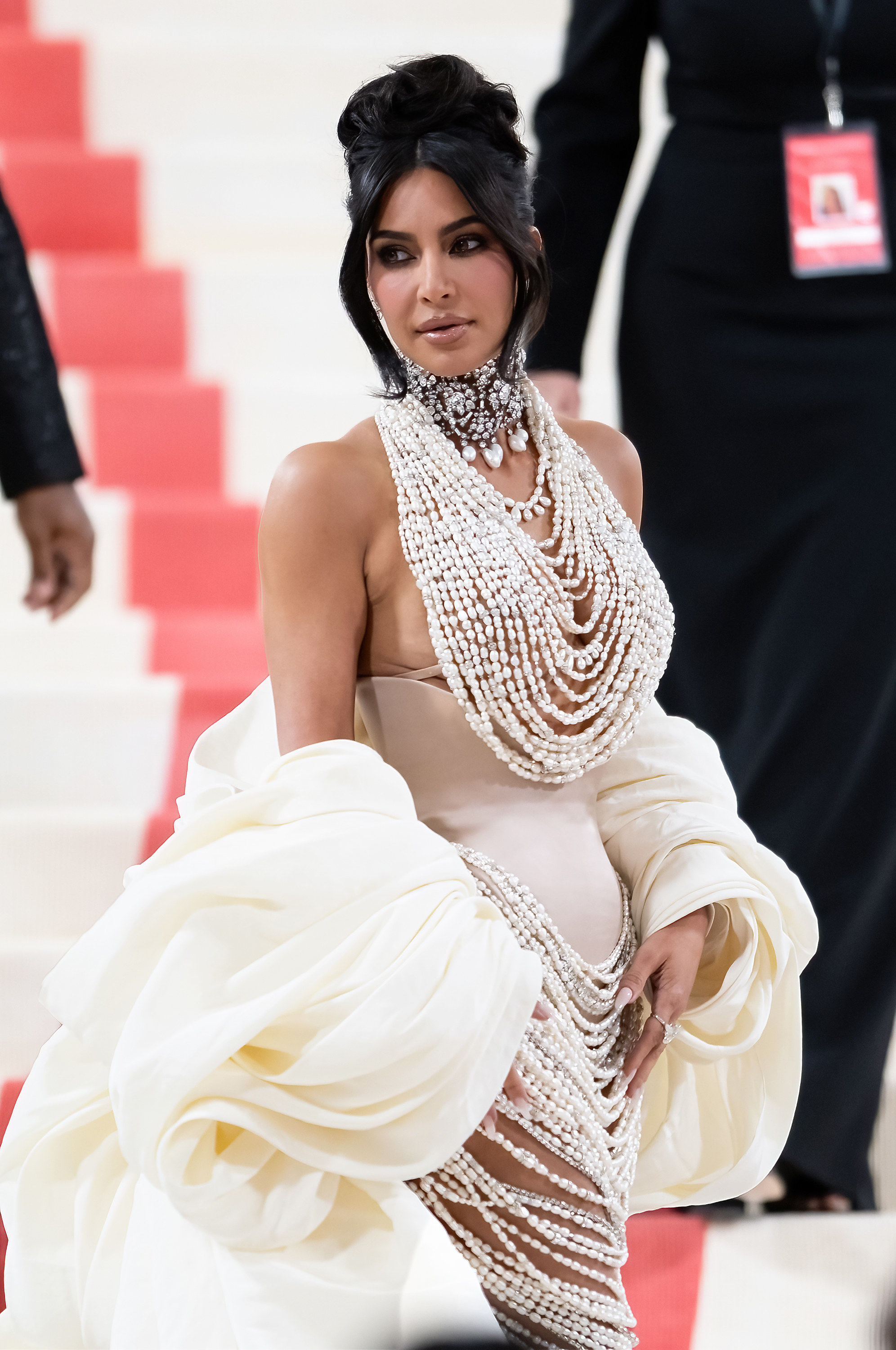 Kim dripping in pearls on the top and bottom of her corset last night