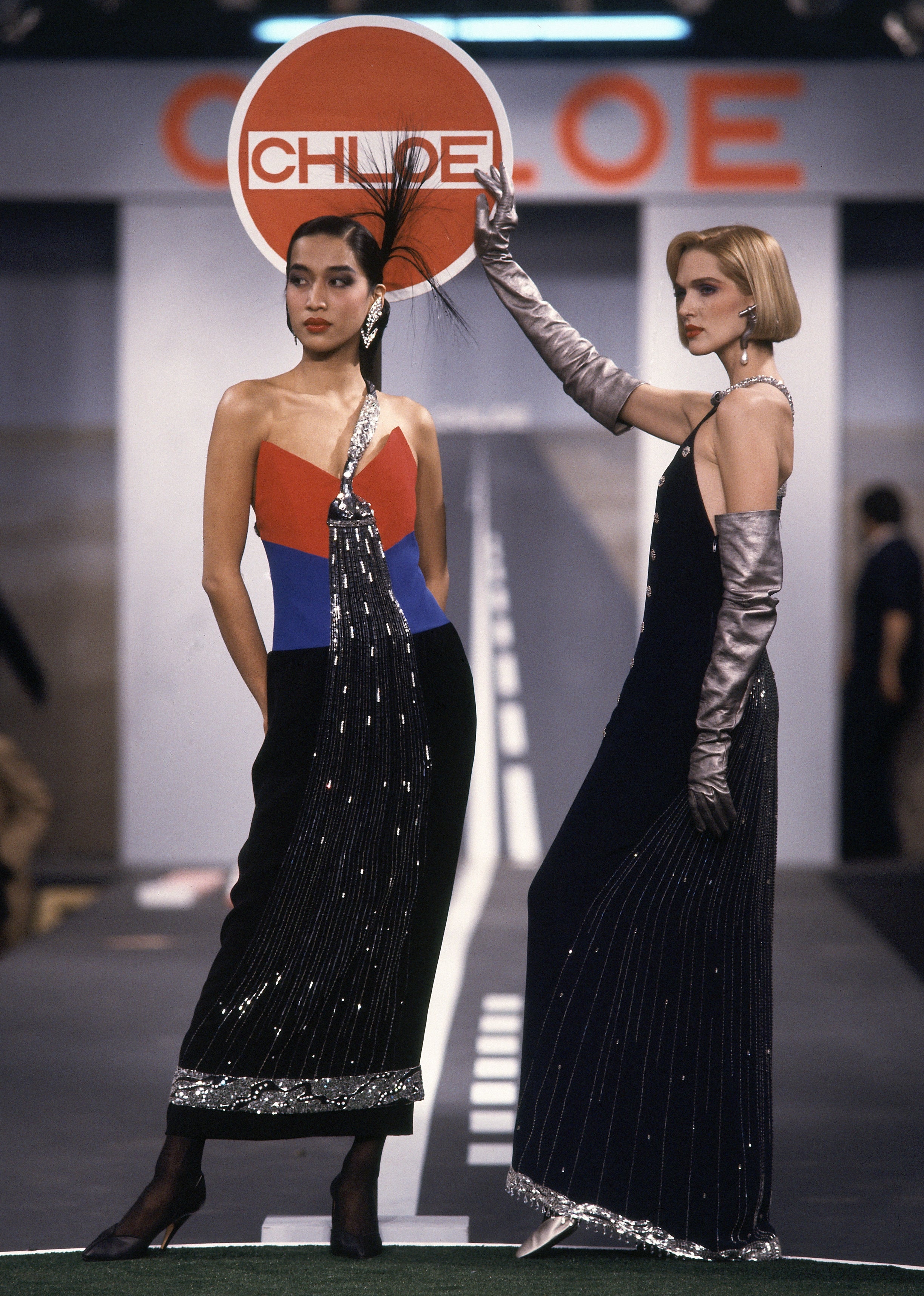 Models wearing splashy beaded faucet dreses in silk crepe on the runway of Karl Lagerfeld&#x27;s Fall 1983 Ready-To-Wear collection for Chloe