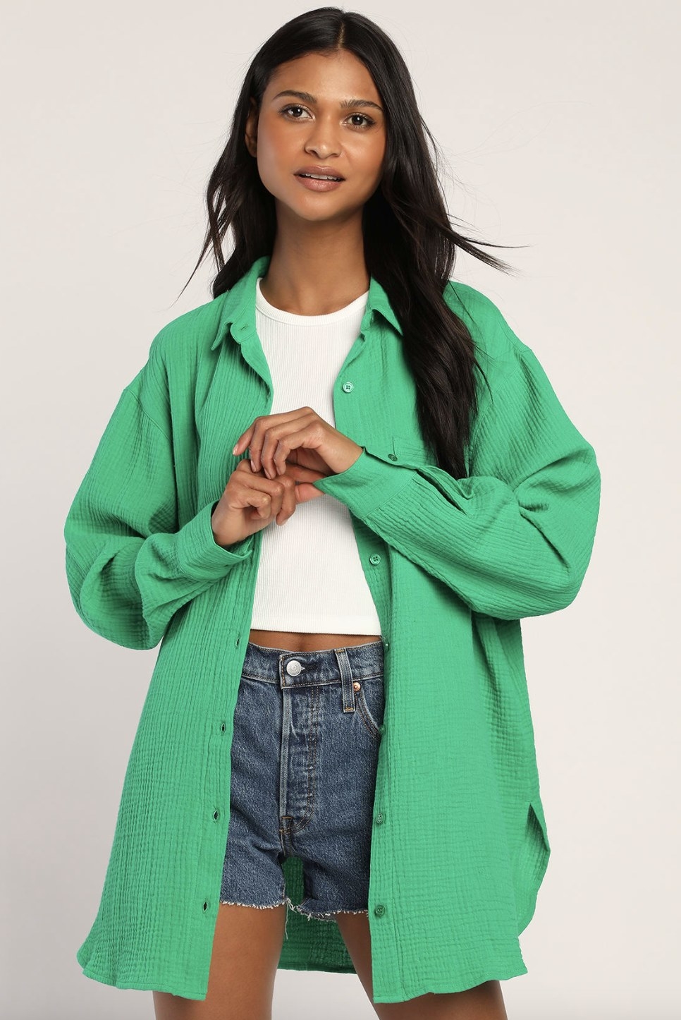 A model wearing the top in green