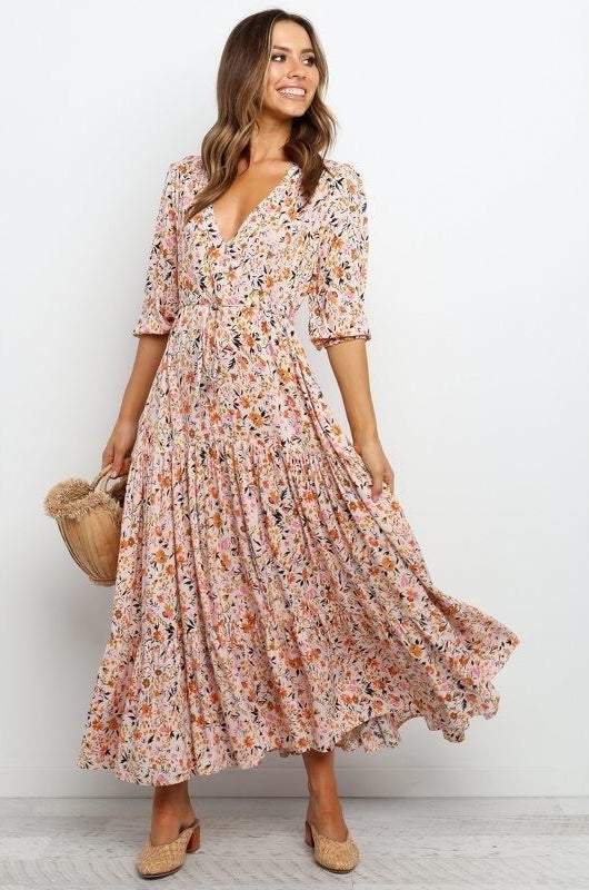 Model wearing flowwy multicolored floral maxi dress
