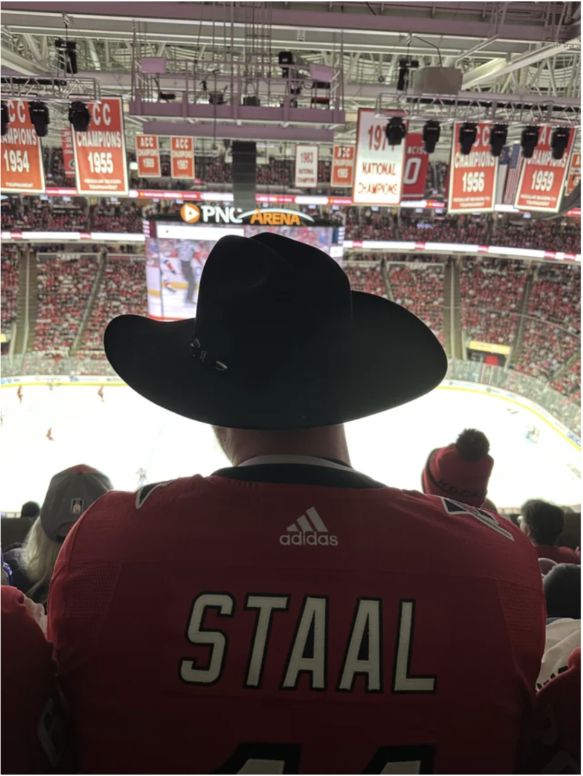 game blocked by a large cowboy hat