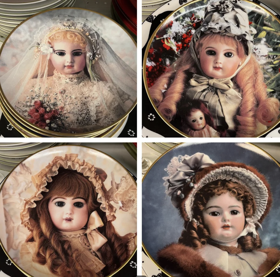 Plates with faces of old-fashioned dolls with ringlets and hats