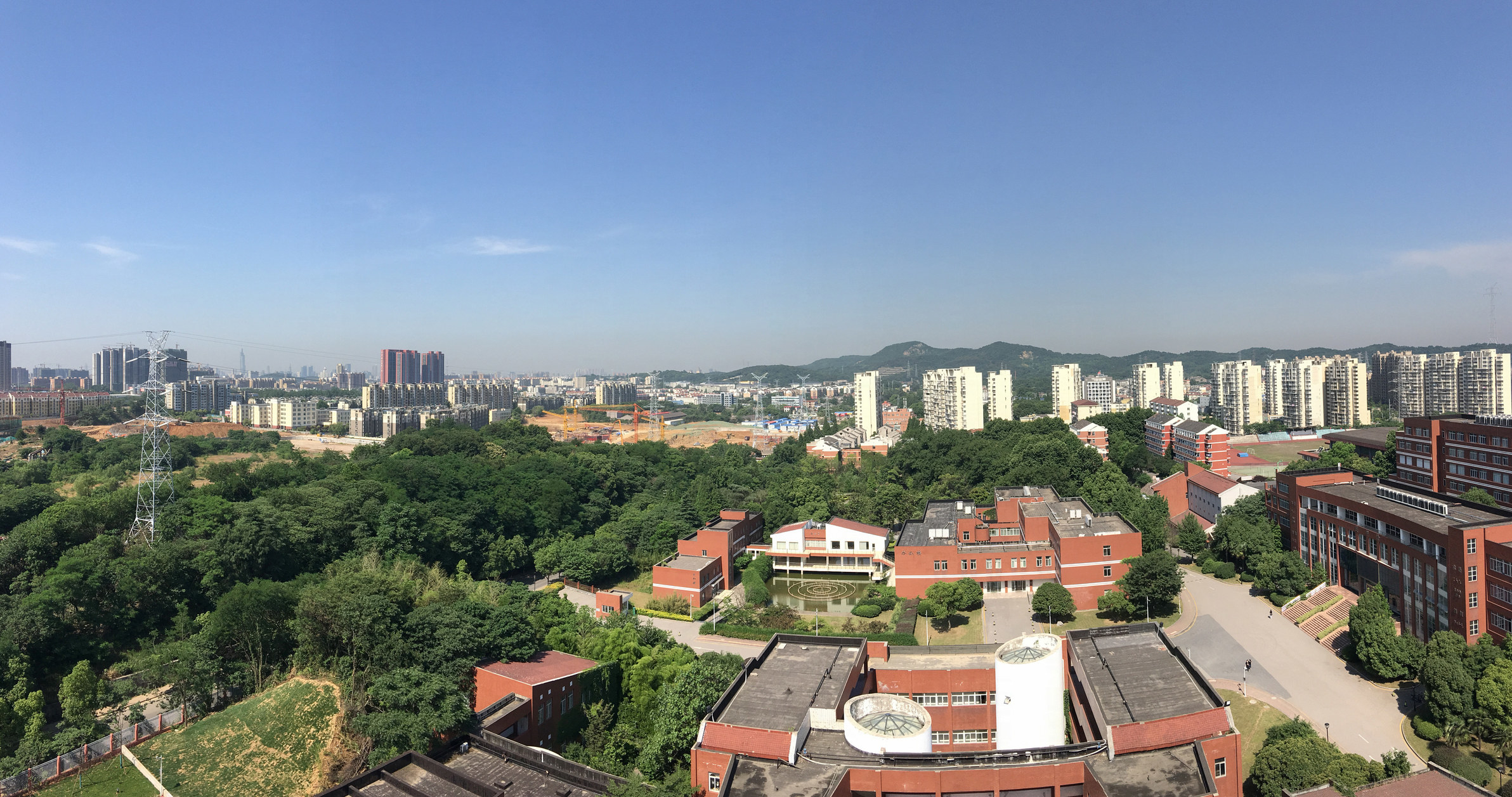 Overview of Nanjing University showing tall buildings and parks with trees