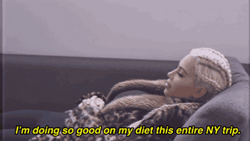 Kim Kardashian lying on a couch in a leopard coat, the caption says &#x27;I&#x27;m doing so good on my diet this entire NY trip&#x27;