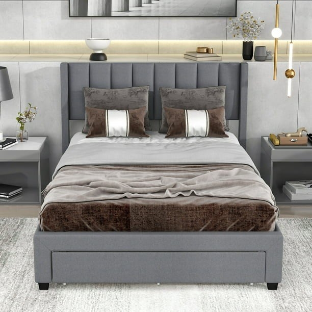 The platform bed with drawers underneath in a bedroom