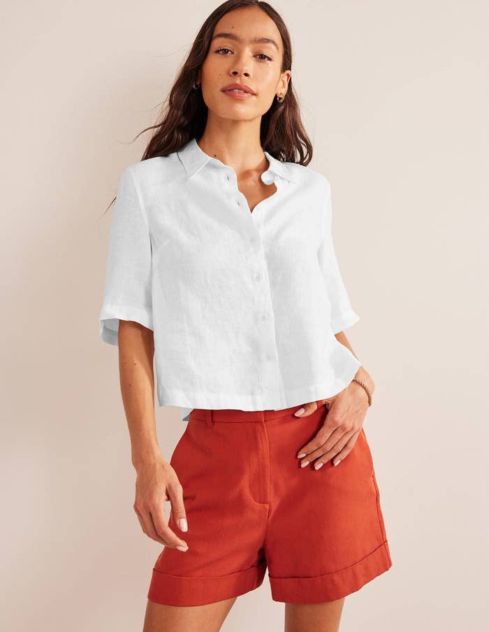 model in white linen short-sleeve button-up shirt