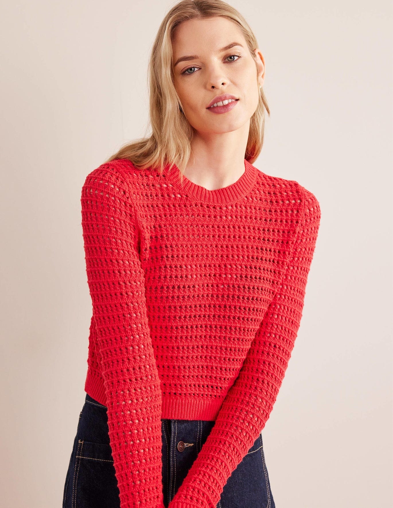 model in long sleeve bright red cropped crochet pullover