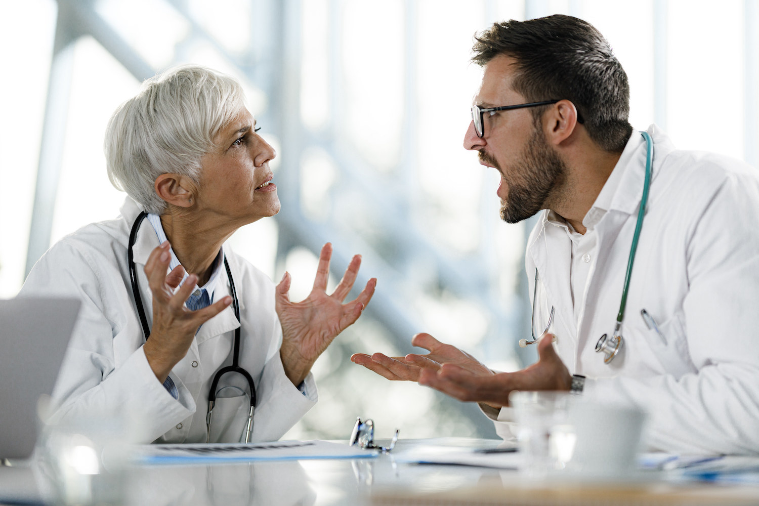 Two doctors yelling at each other