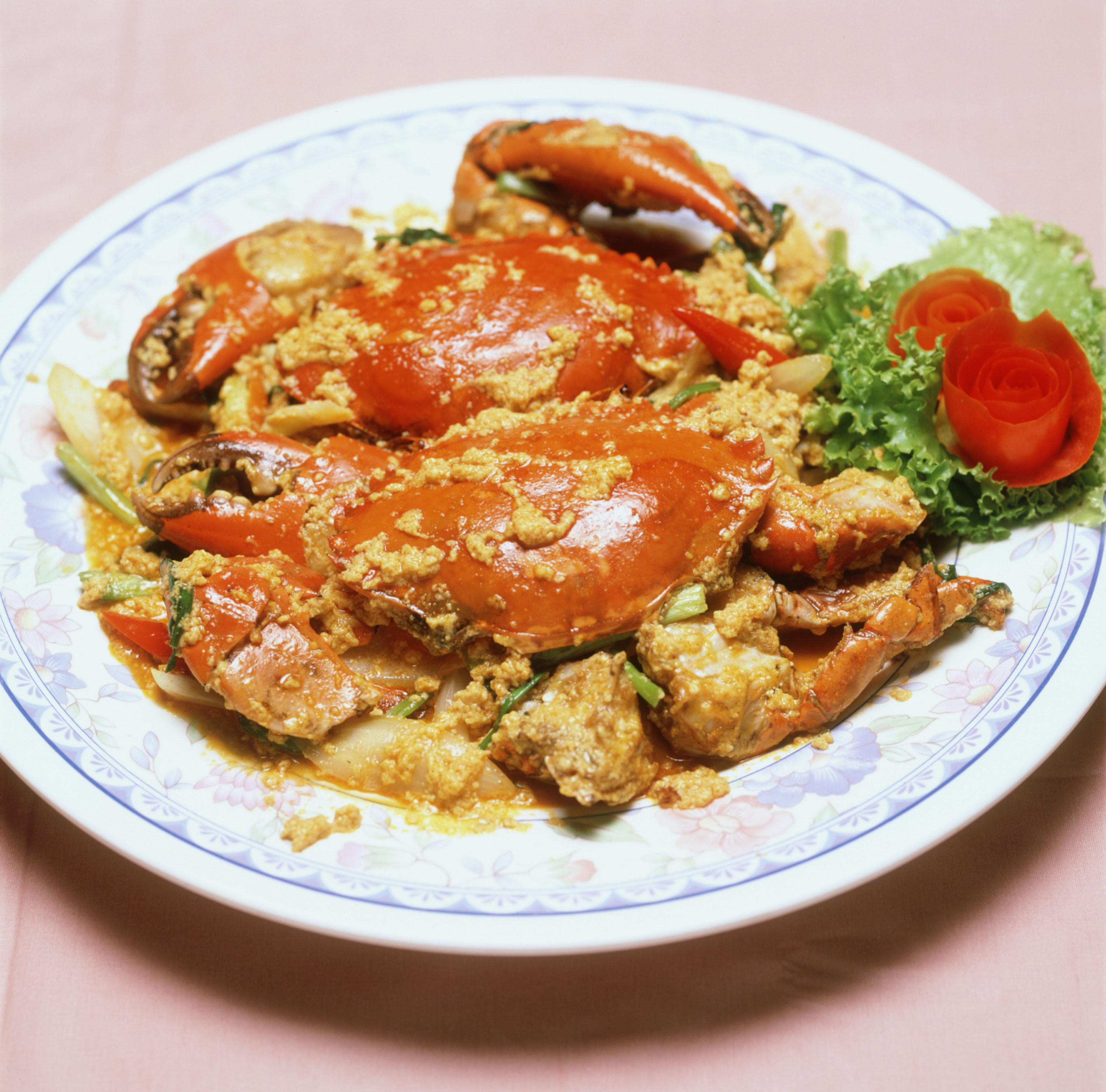Curried crab on a white plate