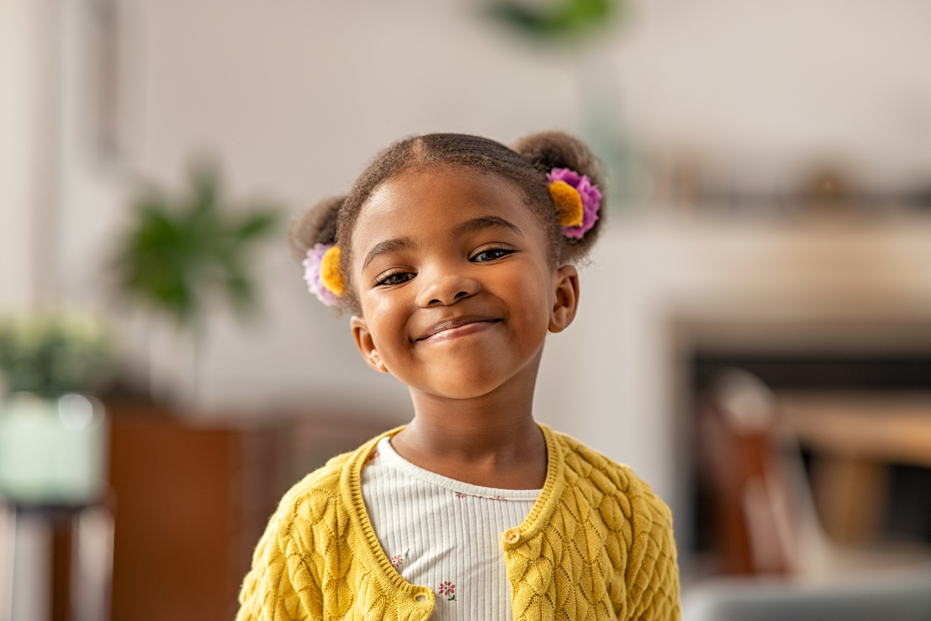 a young girl smiling at the camera