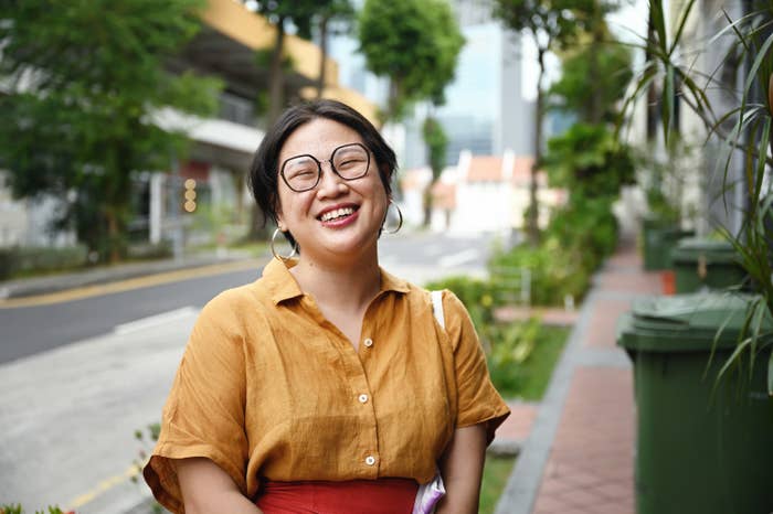 a woman smiling outside