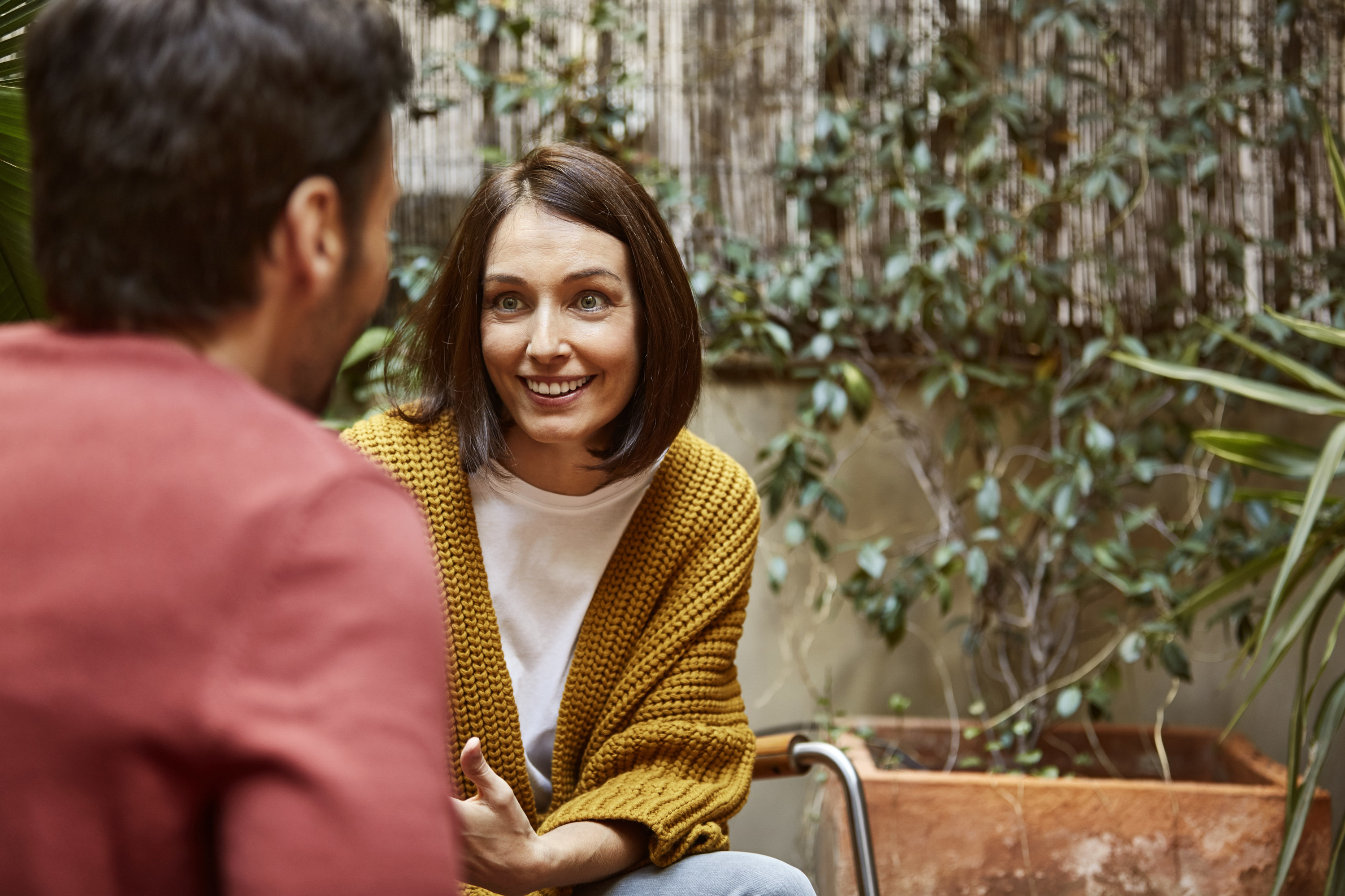 a woman and a man talking