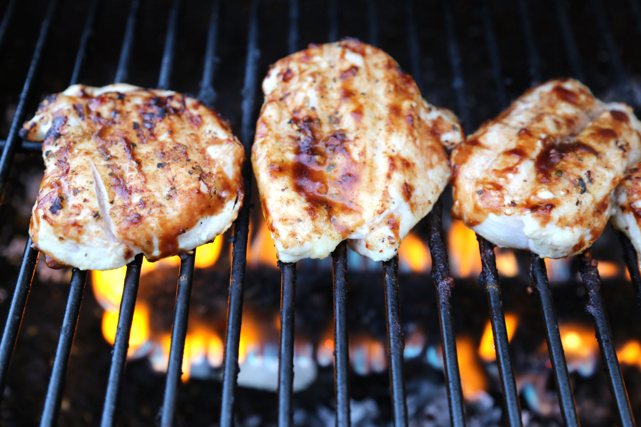 Chicken cooking on the grill.