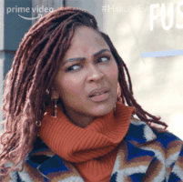 Meagan Good in Harlem looking confused and unclear about something