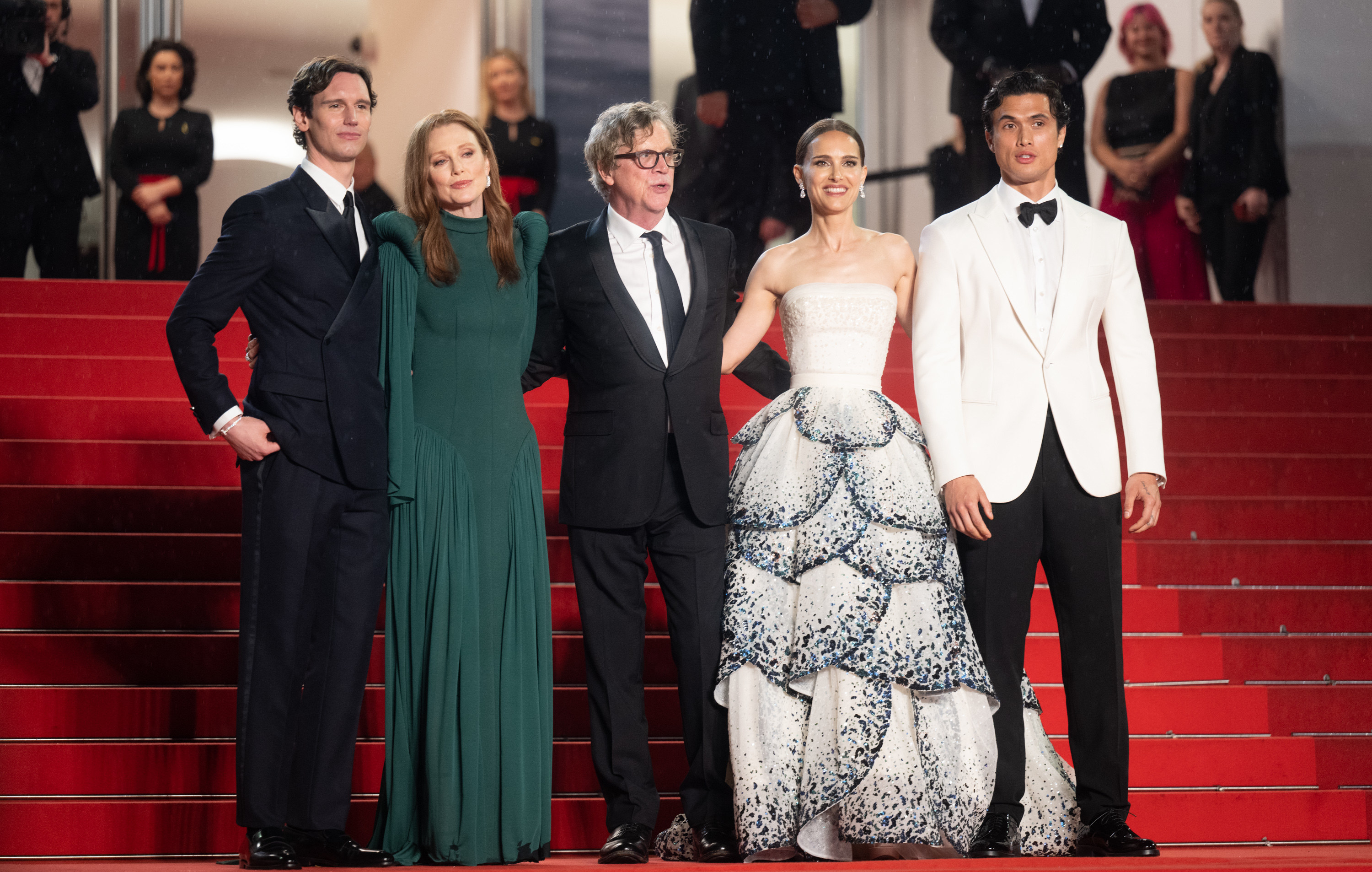 Cory Michael Smith, Julianne Moore, Todd Haynes, Natalie Portman, and Charles Melton pose together on the red carpet