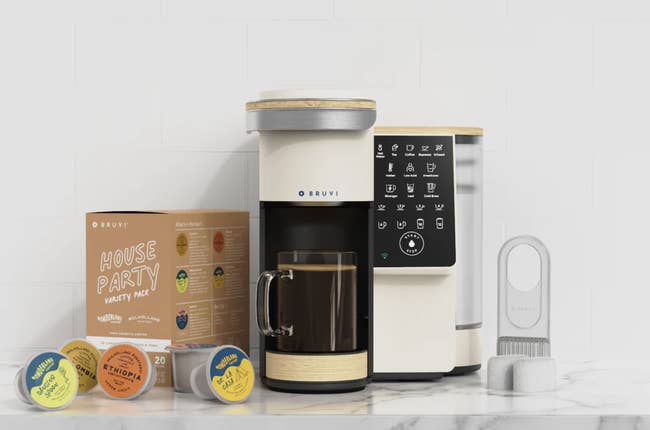 Coffee maker with filters, flavor cups, and packaging