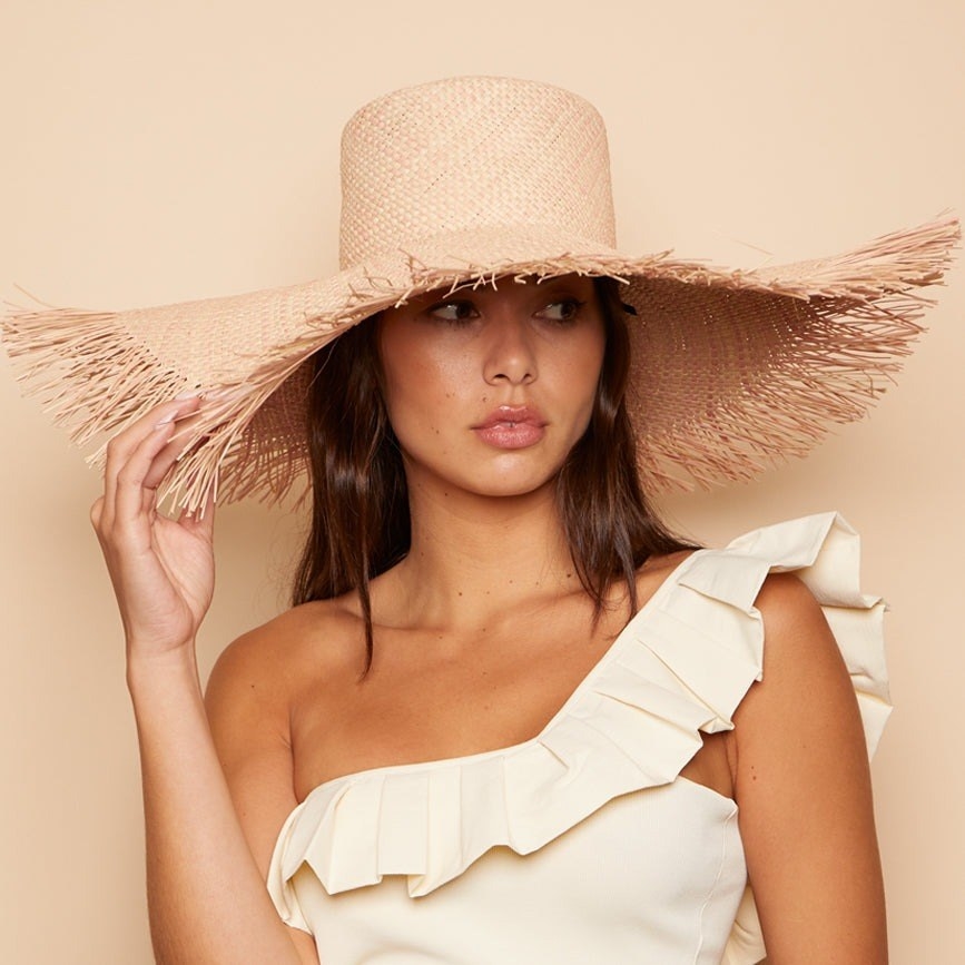 model wearing oversized sun hat